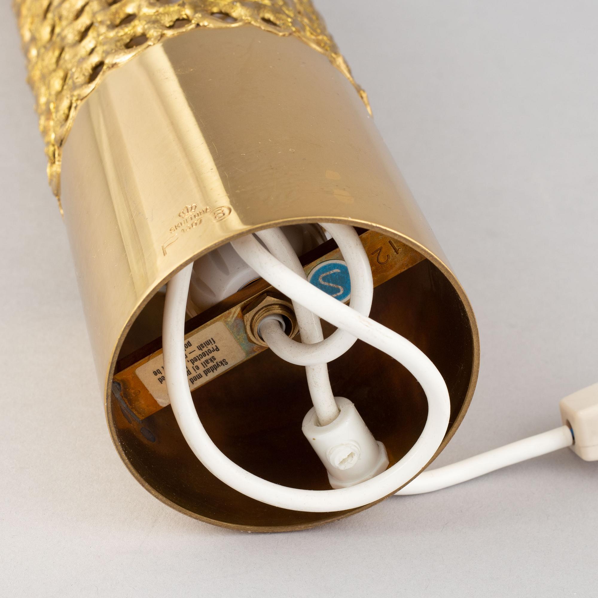 A brass table lamp by Pierre Forssell, second half of the 20th Century.