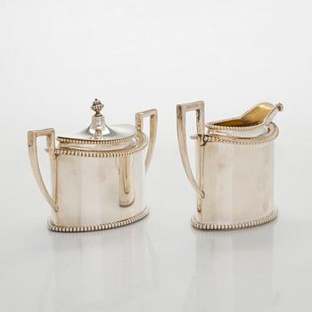 An early 20th century 4- piece sterling silver empire coffee set, C.G. Hallbergs Guldsmeds AB, Stockholm.