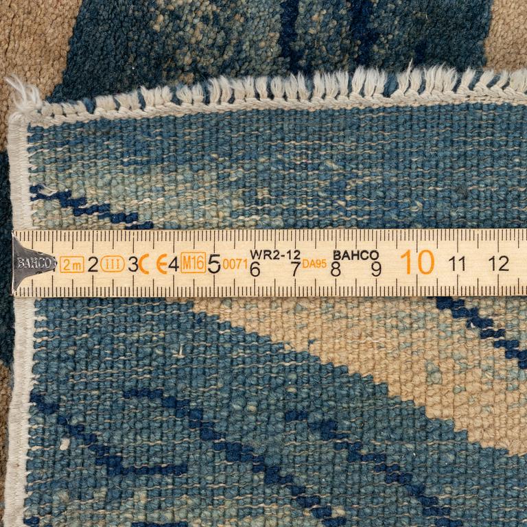 An antique Baotou rug, northern China, late Qing dynasty, circa 1900. c. 178x90 cm.