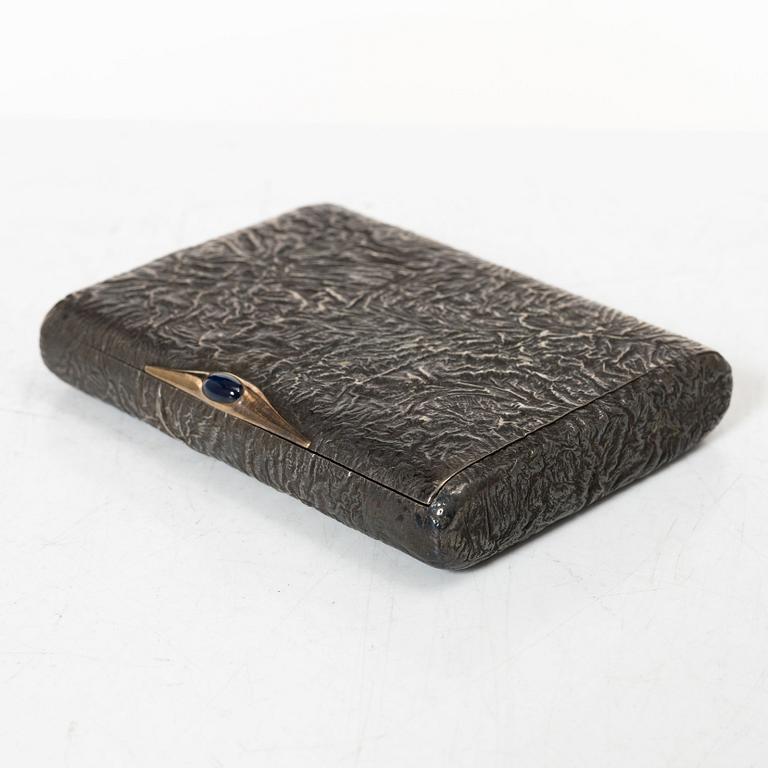 A Russian silver samorodok cigarette case, St. Petersburg 1908-17, unidentified maker's mark, possibly Ivan Arkarov.