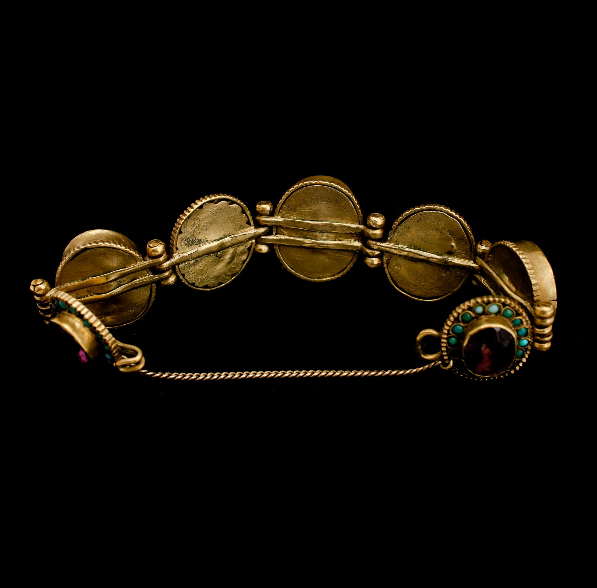 ARMBAND, mässing och turkoser, 1900-talets första hälft.
