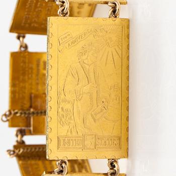 A bracelet with post stamps made of 900 gold..