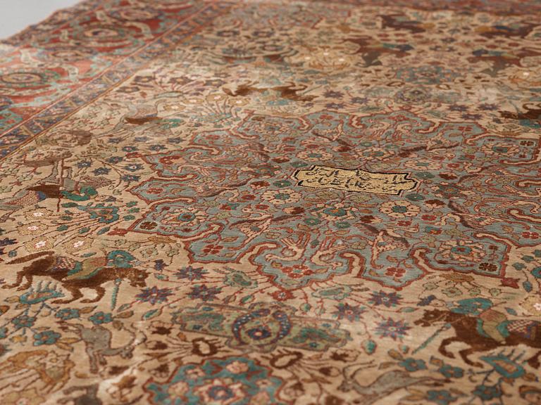 A RUG. A semi-antique silk figural souf (in relief), probably India. 208 x 128,5 cm (as well as two cm flat weave at.