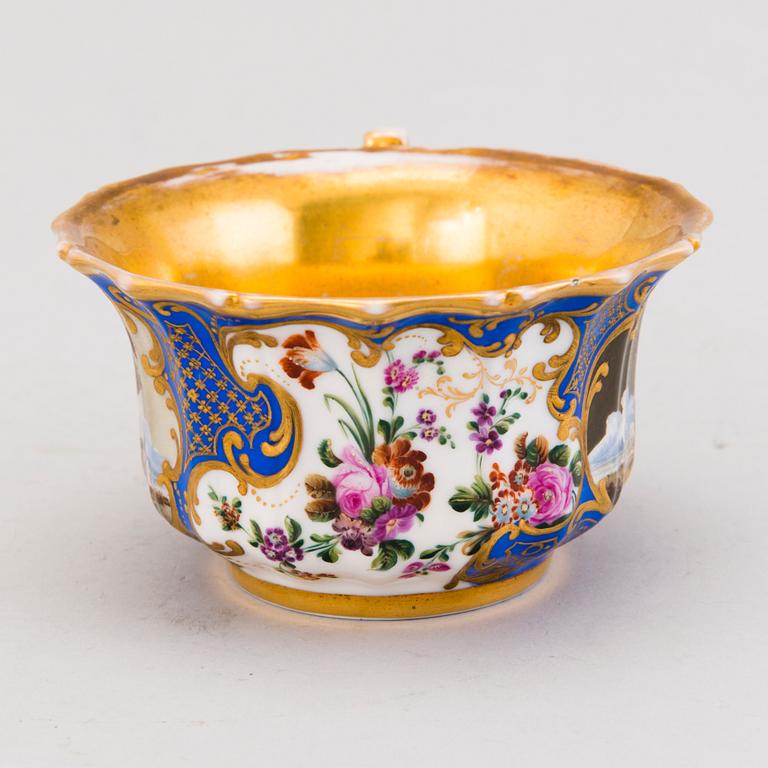 A Popov porcelain cup with saucer, Russia mid-19th Century.