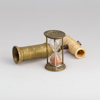 A brass cork screw and hourglass 19th century.