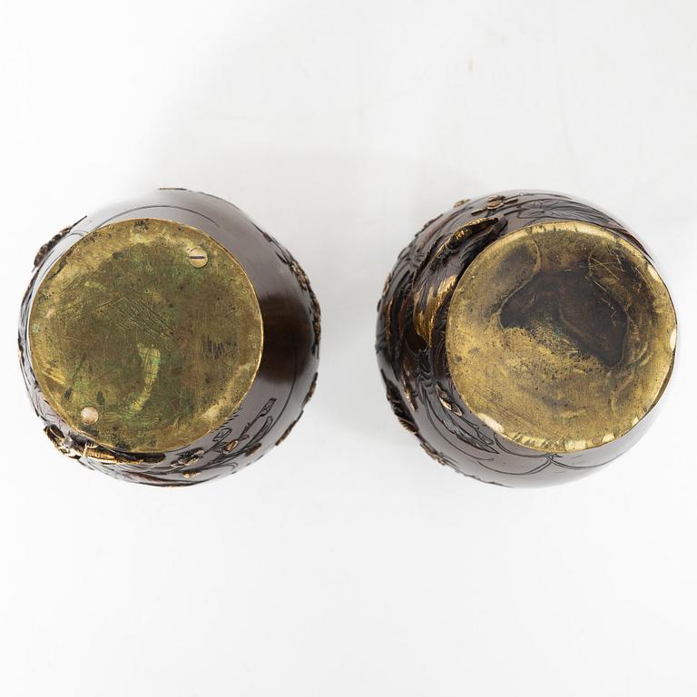 A pair of Japanese metal vases, Meiji (1868-1912).