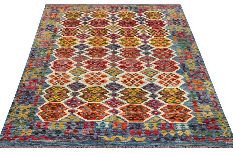 An Afghan Kilim carpet, c. 297 x 206 cm.