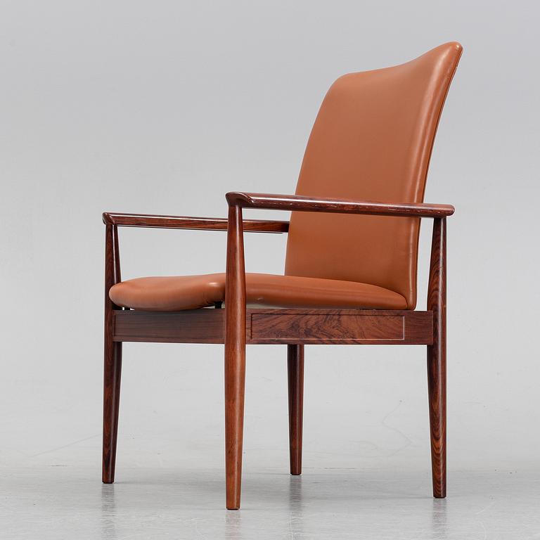 Finn Juhl, a rosewood easy chair, from Cado, Denmark, 1960's/70's.