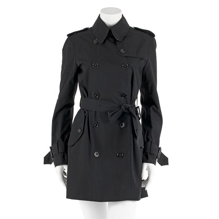 BURBERRY, a black cottonblend ladies trenchcoat. UK size 10.