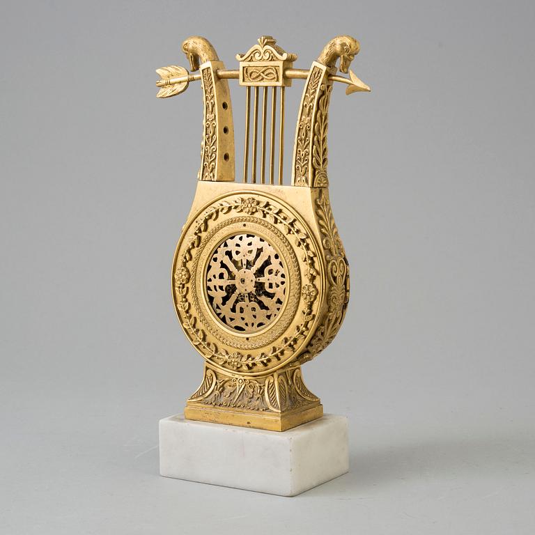 A TABLE CLOCK, empire, early 19th century.