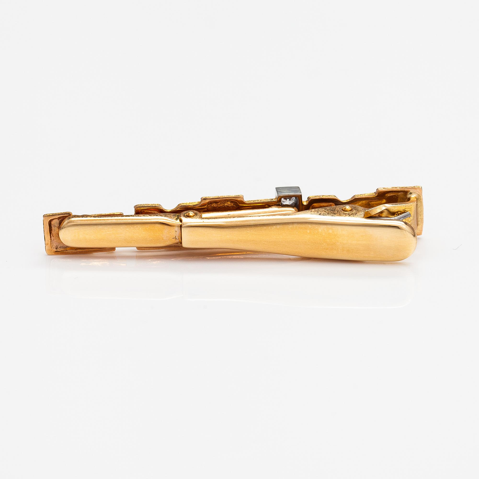 Björn Weckström, Solmioneula ja kalvosinnappipari "Jääriite", 14K kultaa, timantteja n. 0.18 ct yht. Lapponia.