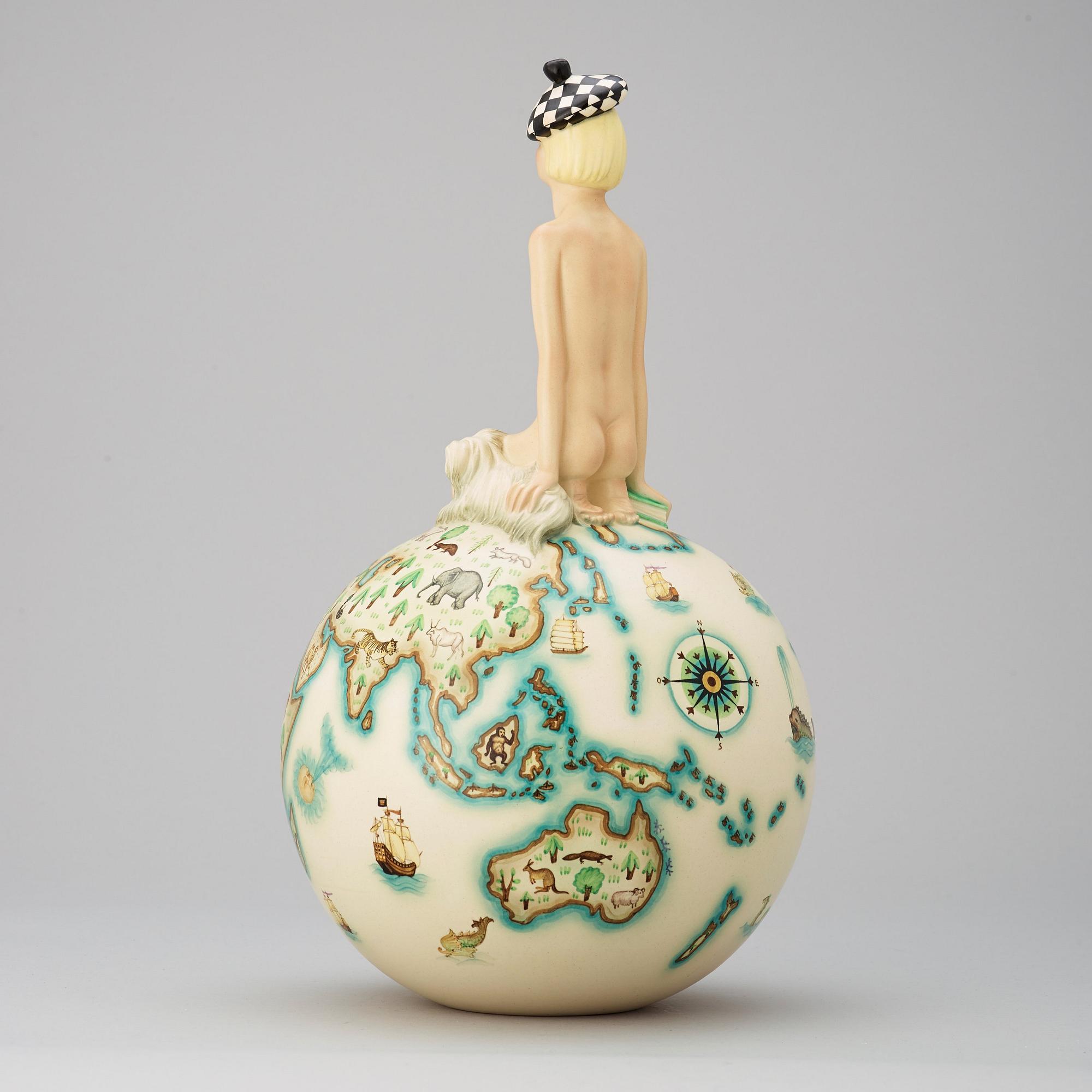 A Mario Sturani (decoration) & Helen König Scavini (form) 'Sul Mondo' glazed earthenware figure, Lenci, Italy 1930's.