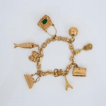 ARMBAND, 18K guld, Corman, Stockholm, 1947 med berlocker av olika halter. Total vikt ca 52,9 g.