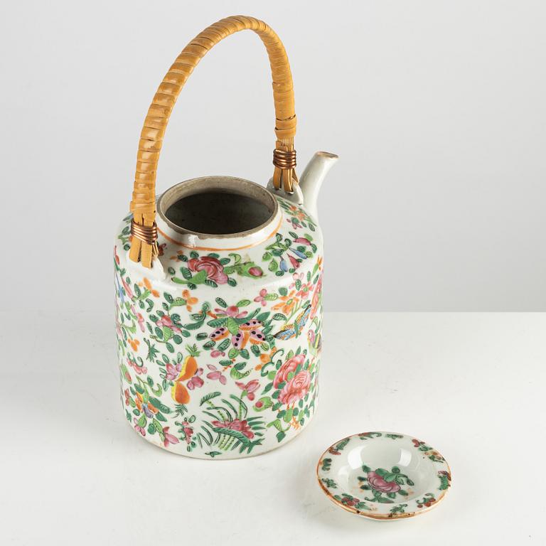 A Canton porcelain teapot and cup with saucer, China, 20th century.