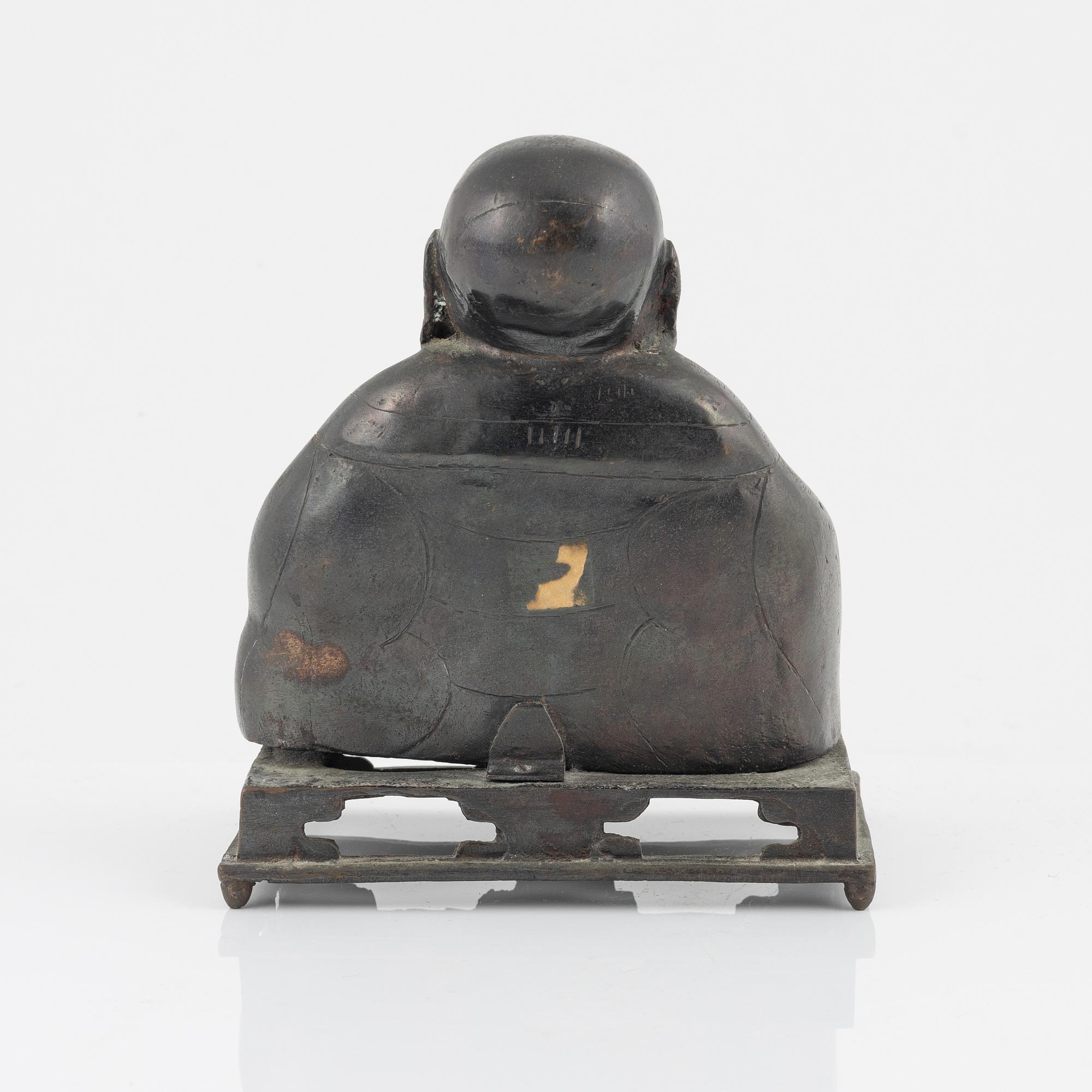 A bronze figure of Buddai, Qing dynasty (1664-1912).