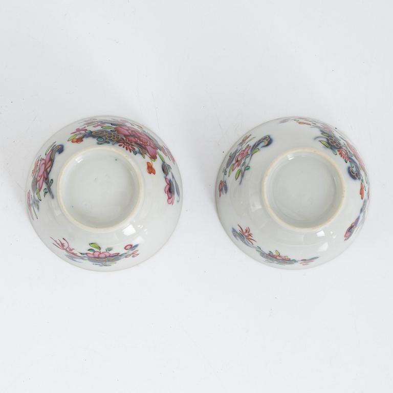 Twelve Chinese famille rose cups on stands, Qing dynasty, Qianlong (1736-95).