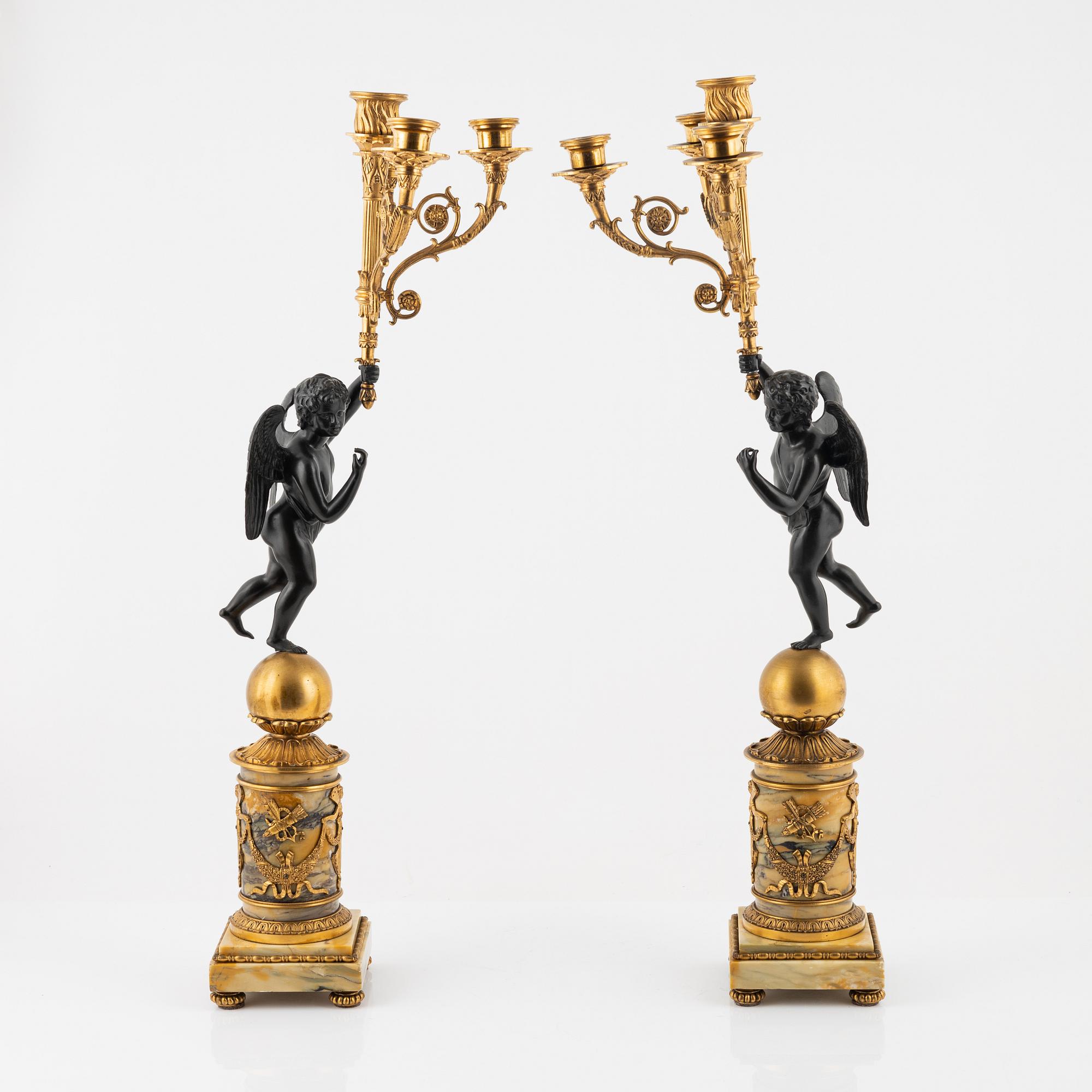 A pair of Empire-style ormolu and marble four-light candelabra, late 19th century.