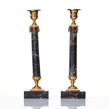 A pair of late Gustavian Portor marble candlesticks, late 18th century.