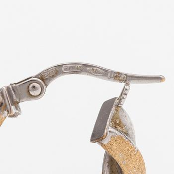 A pair of 14K white and yellow gold earrings. Unoaerre, Italy.