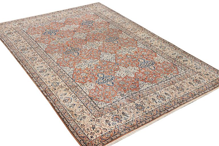 A semi-antique/old Nain carpet, part silk, c. 343 x 230 cm.