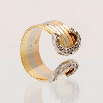 A Cartier "Double C" ring 18K tricolor gold set with round single-cut diamonds.