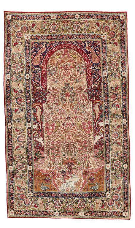 A RUG, an antique/semi-antique Kerman Laver  figural, ca 232,5 x 139,5 cm.