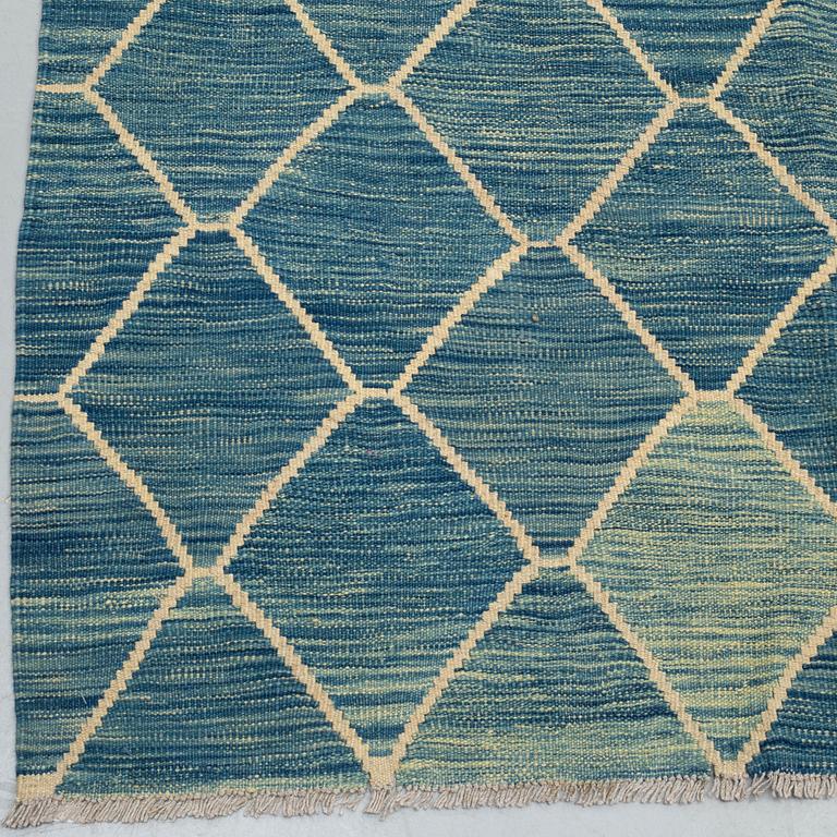 A CARPET, kilim, ca 401 x 294 cm.