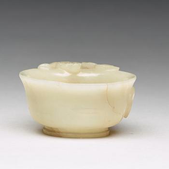 A carved nephrite Qilong goblet, Qing dynasty (1644-1912).