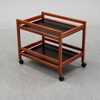 Børge Mogensen, a model '5370' teak and laminate trolley from Frederica Stolefabrik, Denmark.