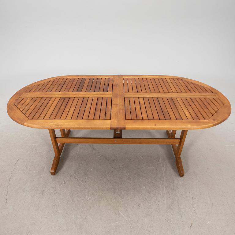 A 9 pcs stained teak garden suite by Brafab around 2000.