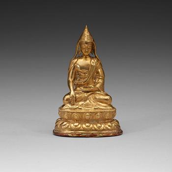 205. A Tibetan copper alloy figure of a Lama, circa 1900.