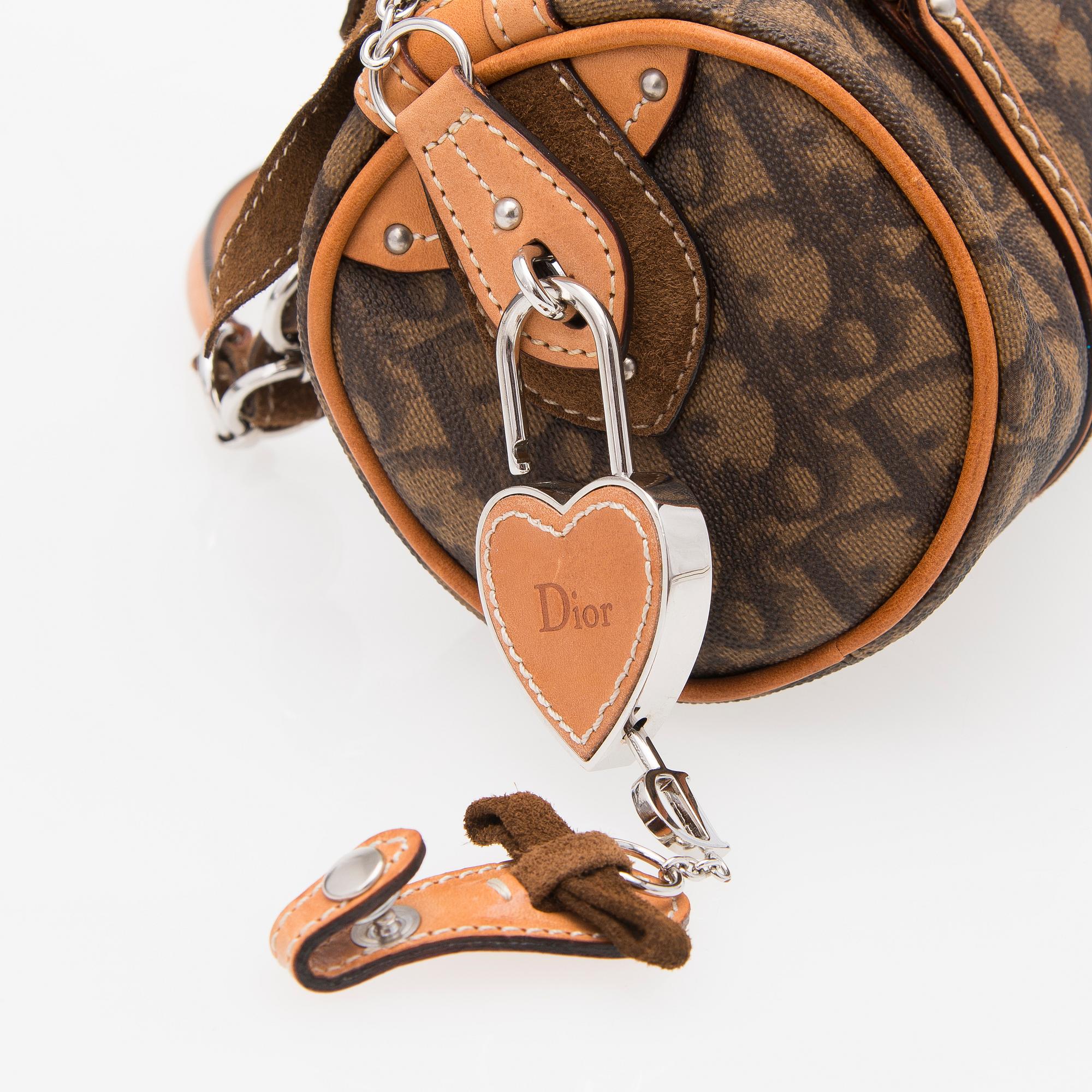 A Monogram Trotter Romantique Round Handbag.