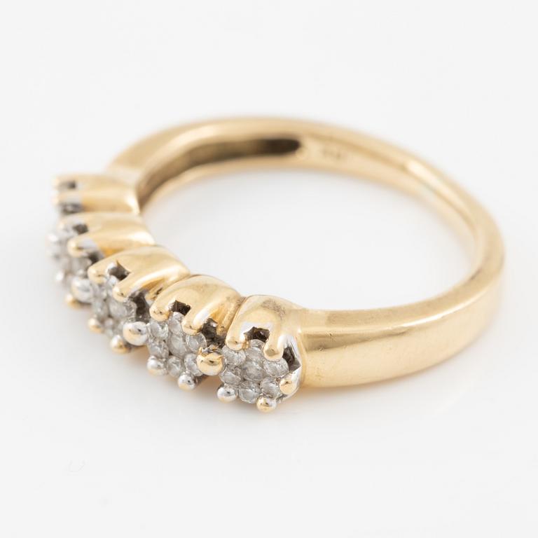 Ring in 18K gold set with small brilliant-cut diamonds.