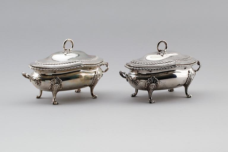 A pair of English 18th century silver sauce-tureens, marks of Sebastian & James Crespell, London 1772.