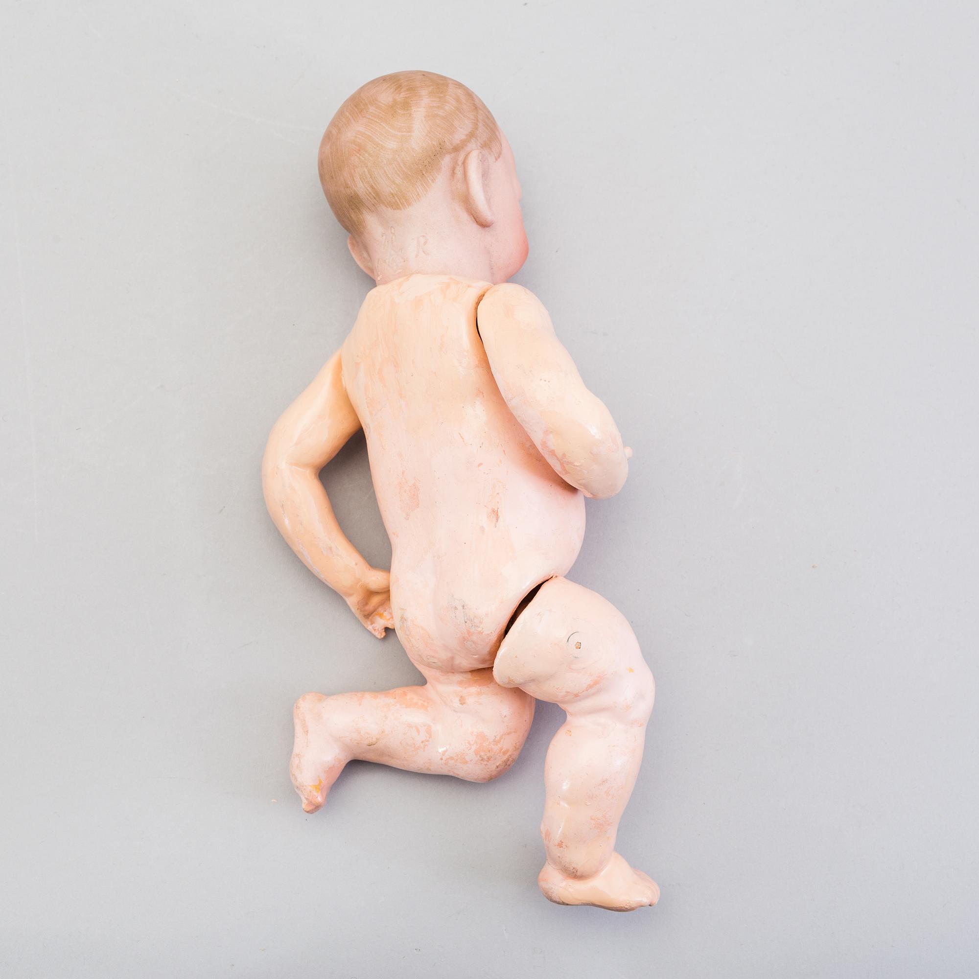 A bisque head character baby doll nr 100 by Kämmer & Reinhardt, Germany, 1910-tal.