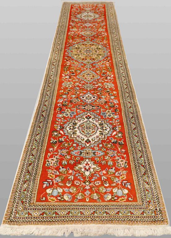 A Tabriz carpet, so-called Tabatabai, c. 423 x 76 cm.