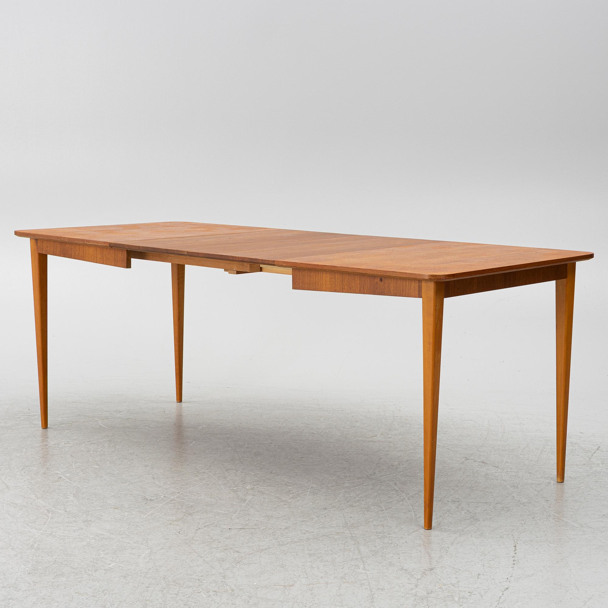 A mid20th century dining table.