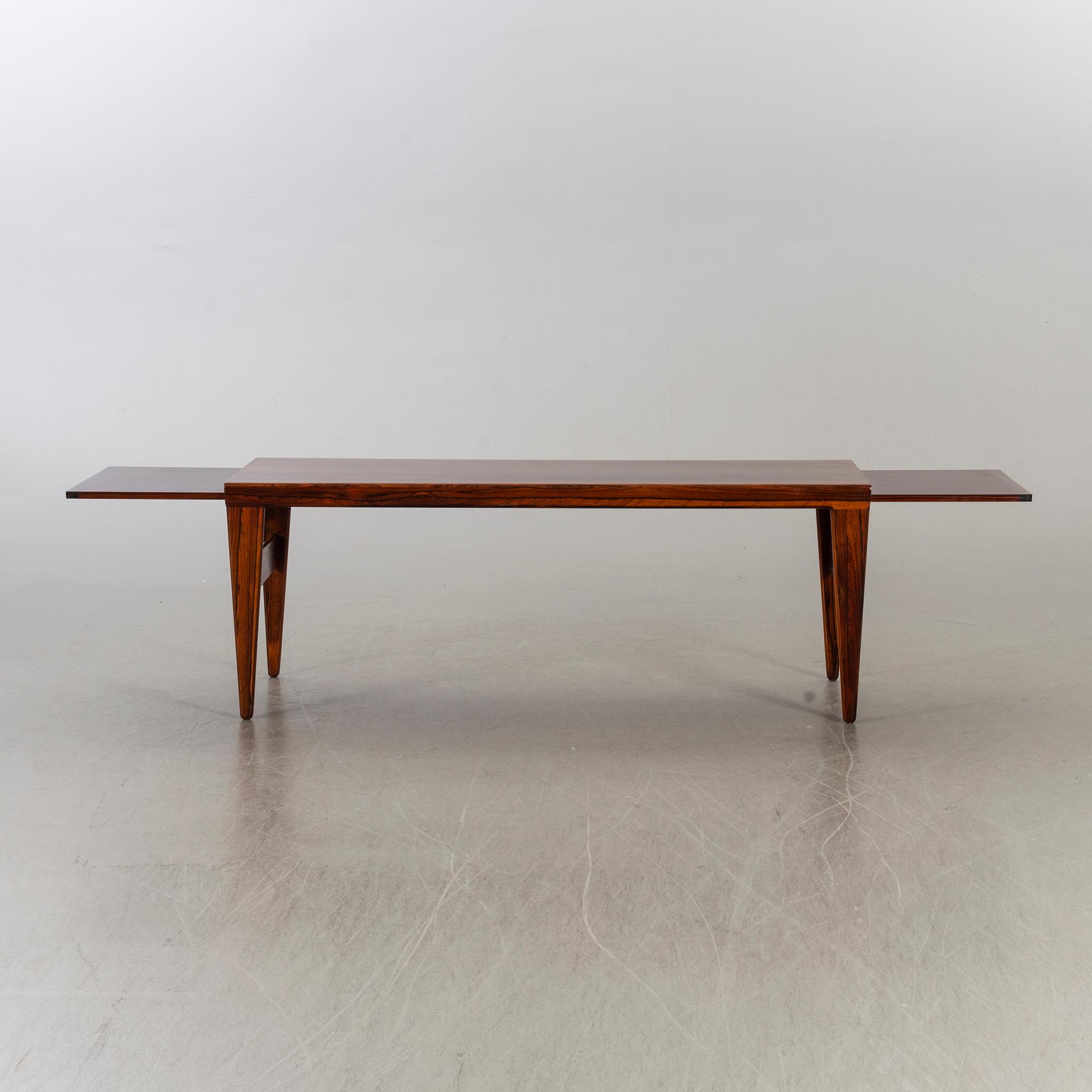 KAI CHRISTENSEN, a danish palisander lounge table.