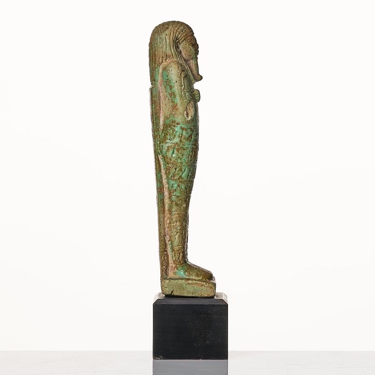 A light green pottery Ushabti Egypt presumably 26:e dynasty ca 650 B.C.