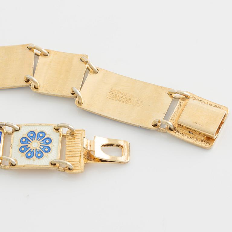 David Andersen, bracelet and two brooches, gilded silver and enamel, Norway.