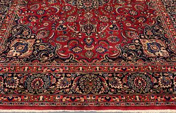 A CARPET, Mashad, signed, ca 385 x 293 cm.