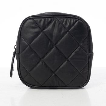 Chanel, tennis racket and 4 balls with case.