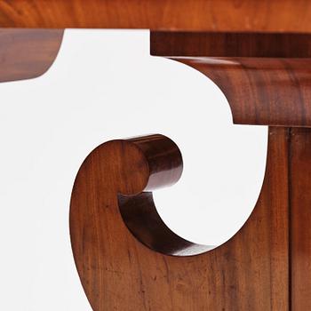 A Swedish Empire mahogany center table.