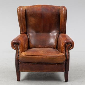 A leather upholstered easy chair , second half of the 20th Century.