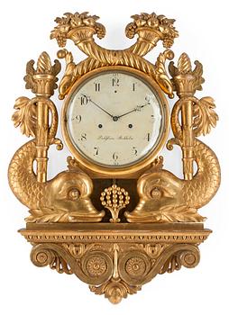 786. A Swedish Empire early 19th century gilt wood wall clock by I. Dahlström.
