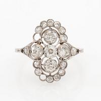 Platinum ring set with round old-cut diamonds, early 20th century.