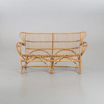 A mid 20th century ratten couch.