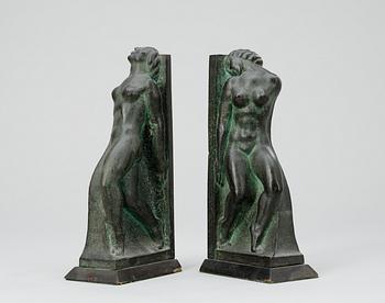 A pair of Axel Gute patinated bronze bookends, Sweden 1920's.