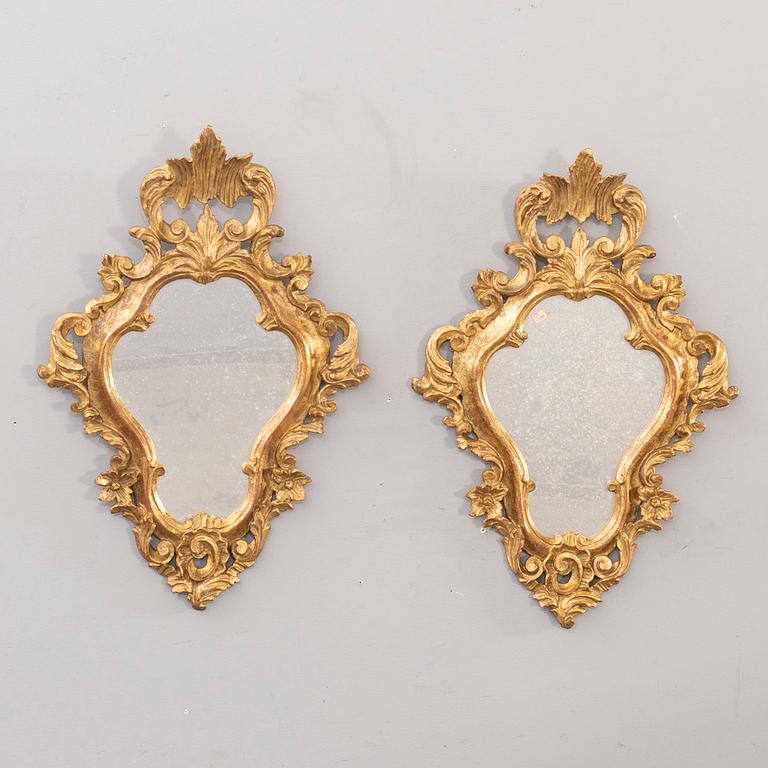 A pair of mid 20th century wood mirrors in LouisXV-style from Paoletti, Firenze Italy.