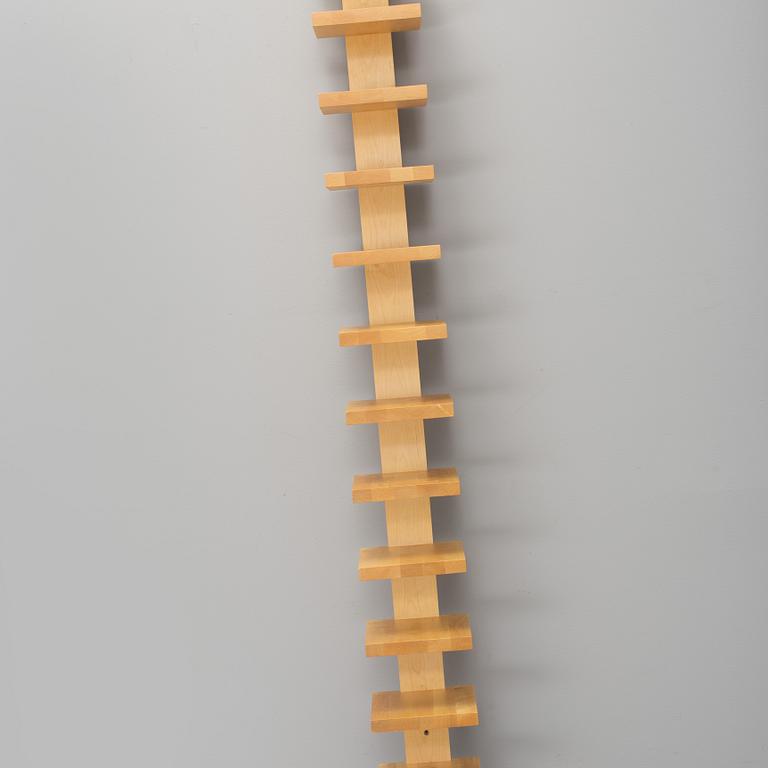 JOHN KANDELL, a "pilaster" wall shelf from the late 1900's.